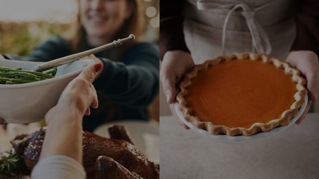 People passing food around a table